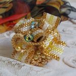 Sunflower Gold Haute-Couture ring embroidered with 24K gold-plated seed beads and Swarovski crystals 